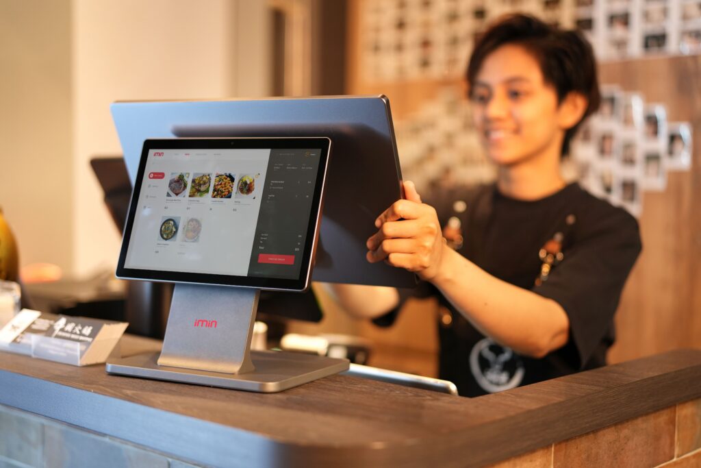 Retail cashier using a touchscreen point-of-sale system
